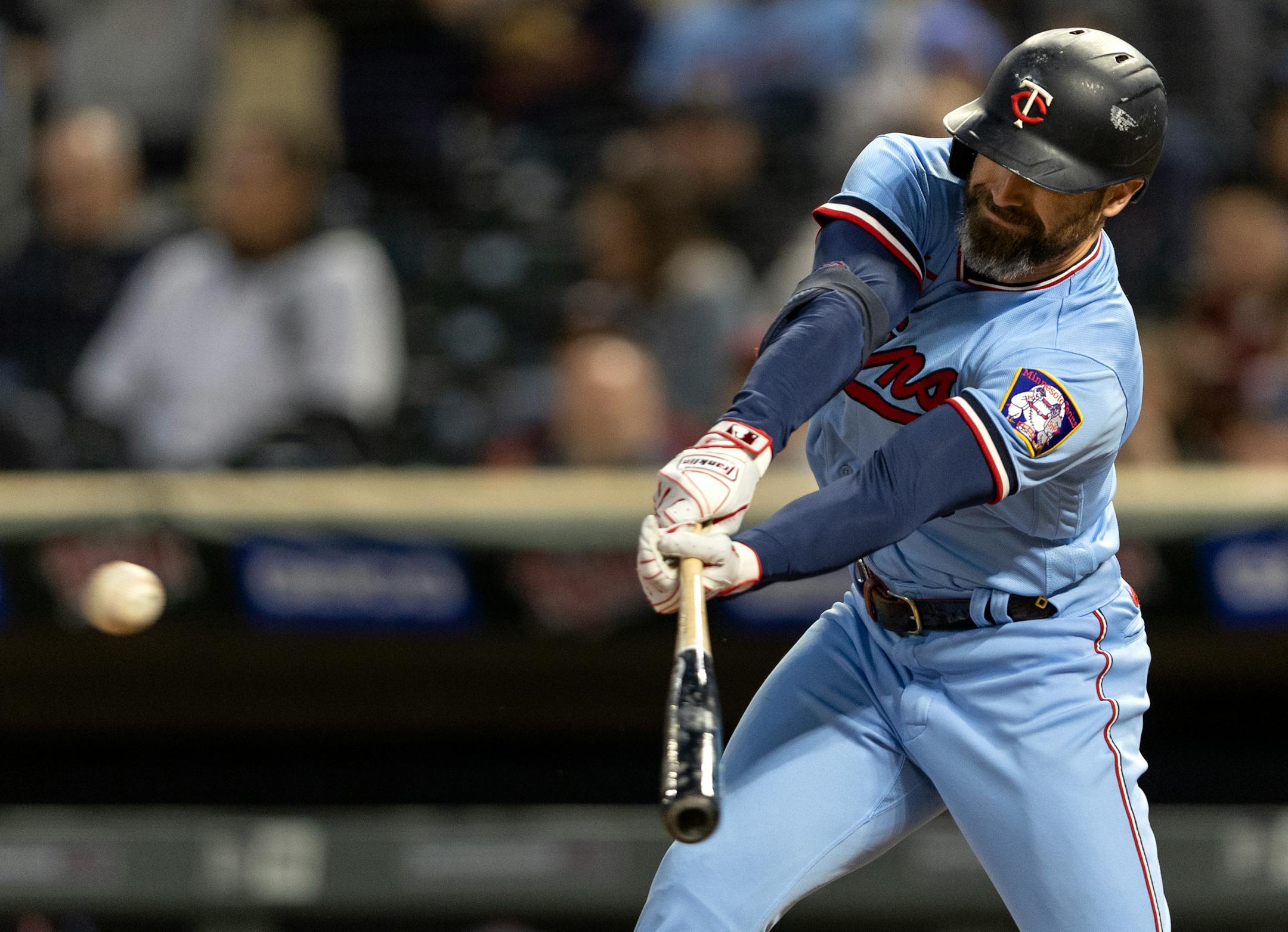 Jake Cave of the Minnesota Twins drives in a run in the first inning.