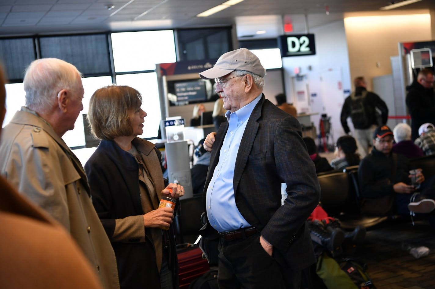 Tina Smith greeted former Vice President Walter Mondale at MSP Airport on the way to D.C. for her swearing in. On the left is Smith's father.