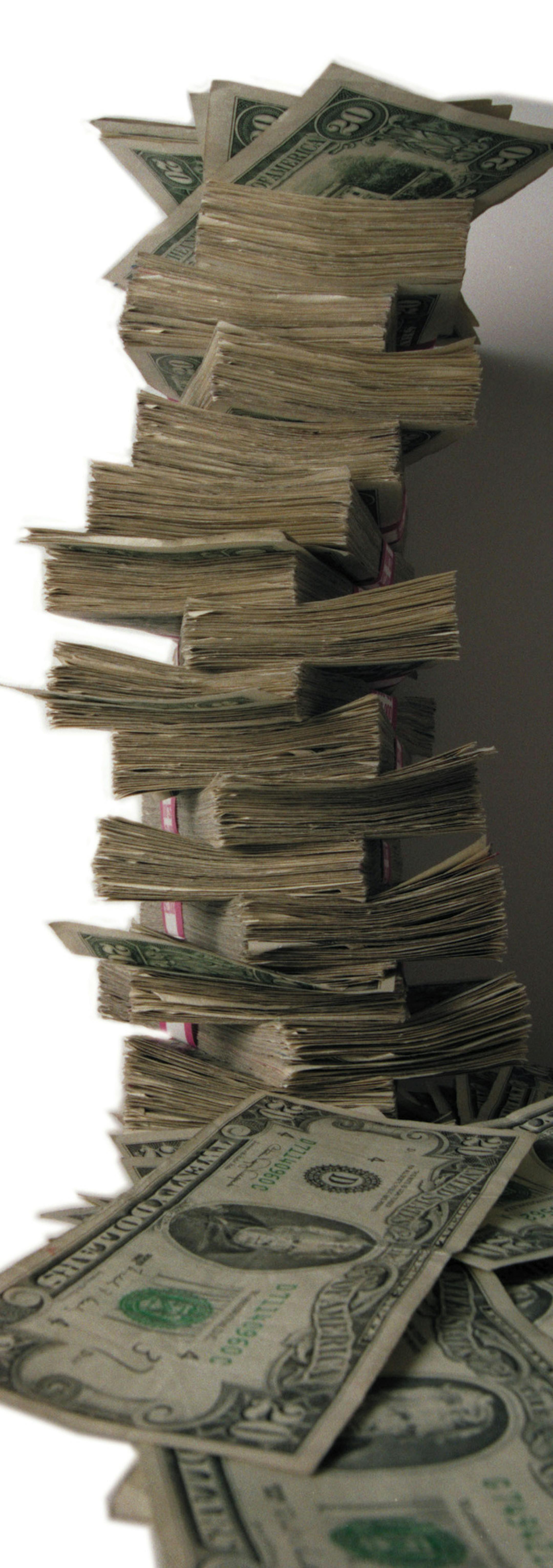 A light look at the state surplus. Photograph $100,000 in cash -- A pile of cash to illustrate the light hearted look at the state surplus. This is about $30,000 in 20 dollar bills. If you are thinking about cloning more to the pile, be advised thateach band holds 100 bills which means that each one equals $2,000. (There are 15 bands in this picture plus some loose bills or $30,000 plus the loose change.) If you clone, be sure to add Photo Illustration to the credit on this pix.