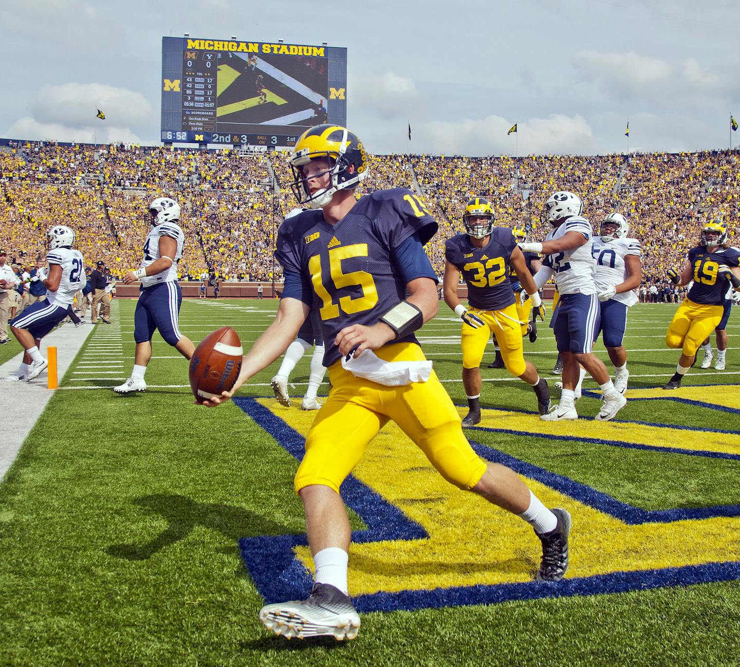 Michigan quarterback Jake Rudock (15) celebrates his touchdown in the first quarter of an NCAA college football game against BYU in Ann Arbor, Mich., Saturday, Sept. 26, 2015. (AP Photo/Tony Ding)