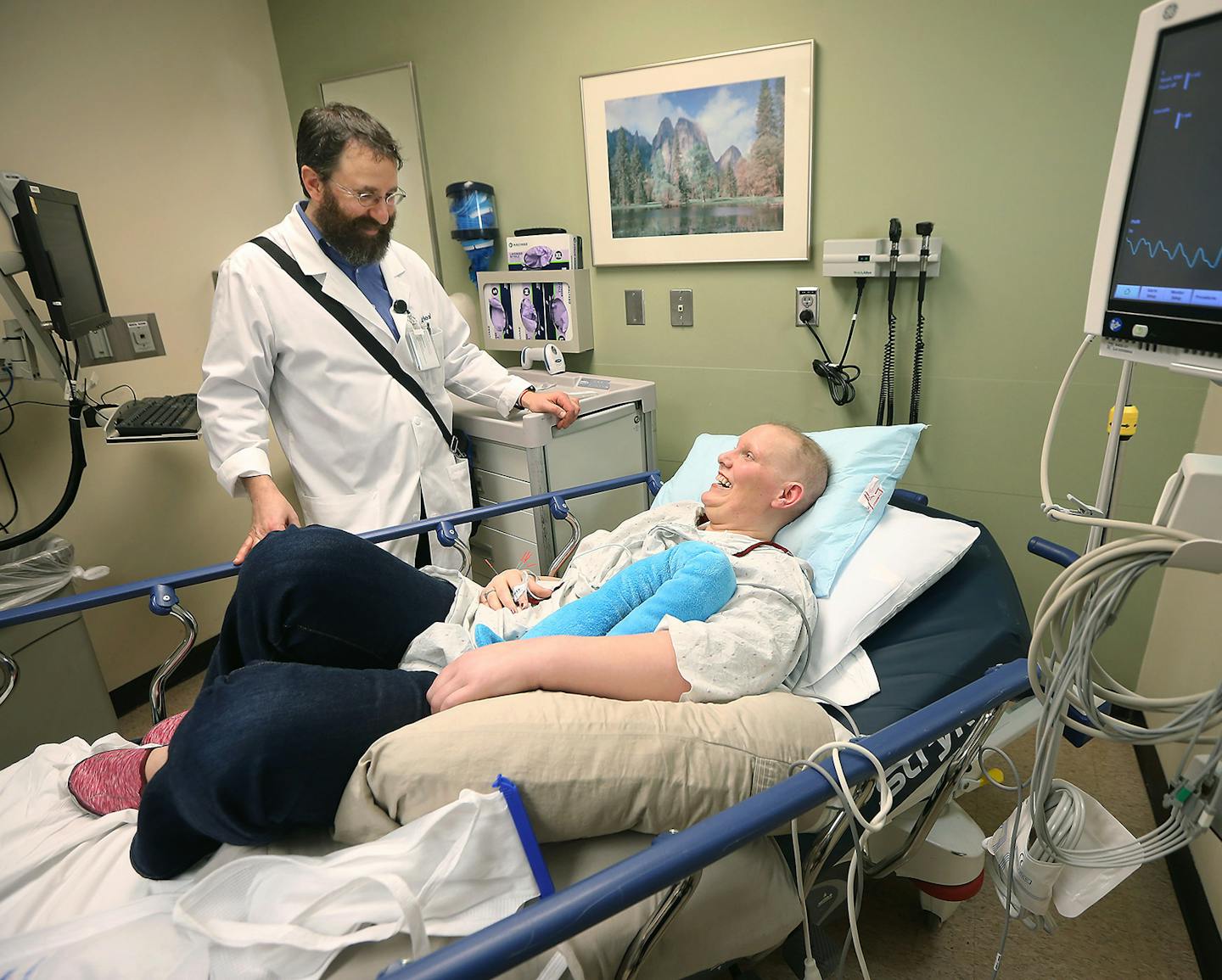 Acupuncture Specialist Adam Reinstein, cq, met with cancer patient Julie Valley before giving her an acupuncture treatment at the Abbott Northwestern emergency room, Monday, March 7, 2016 in Minneapolis, MN. The hospital is reporting success posting an acupuncturist in its ER to provide pain relief to patients. More than half of ER patients report pain, and about half of those patients end up with opioid prescriptions. New study results by Abbott indicate they can manage pain without these medic