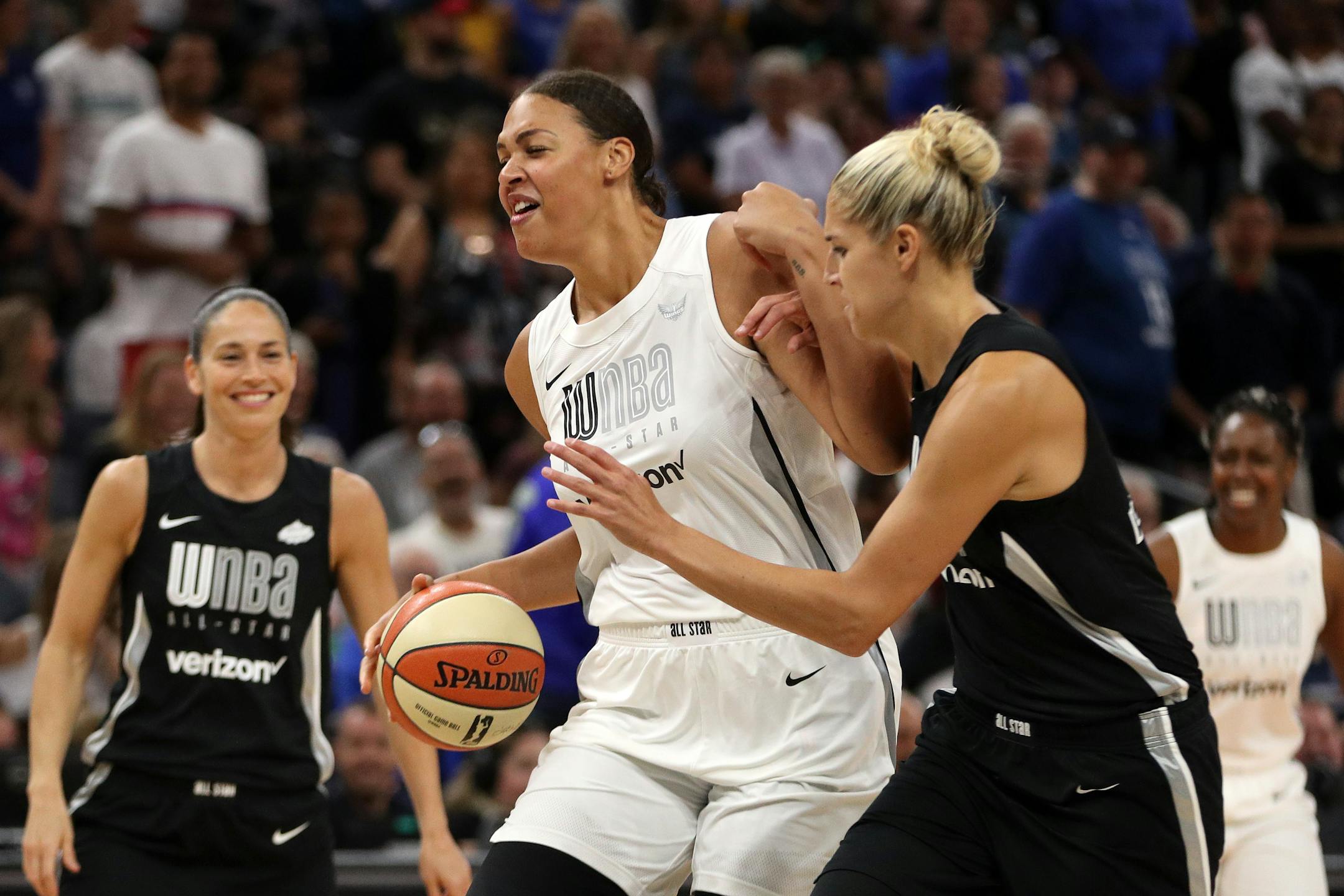 Team Parker center Liz Cambage (8) pushed off Team Delle Donne forward Elena Delle Donne (11) as she drove to the basket in the first half.