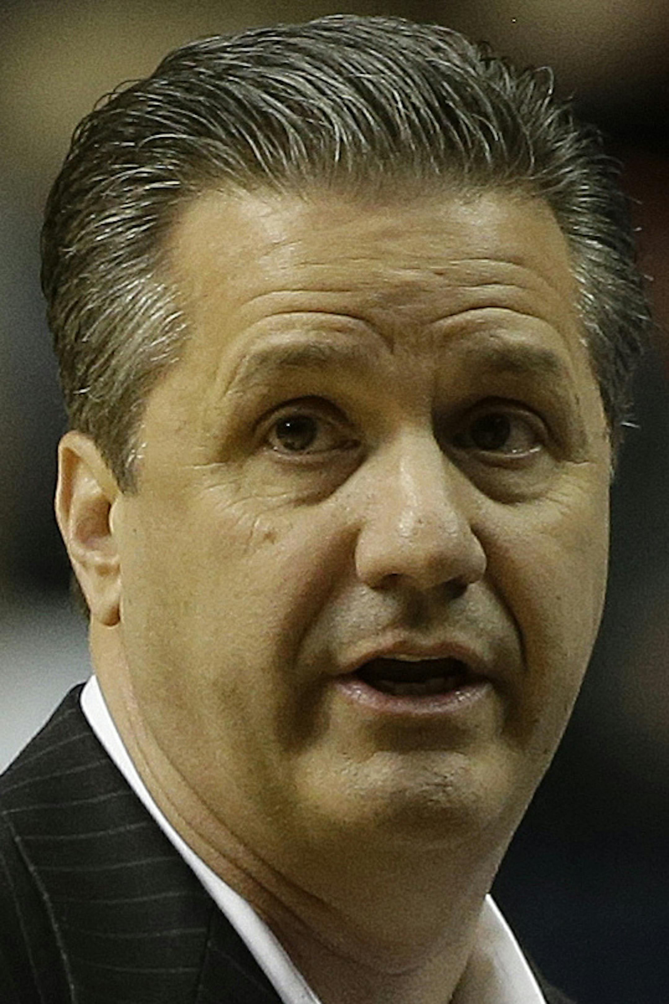 Kentucky head coach John Calipari reacts to a call against the Vanderbilt during the first half of an NCAA college basketball game at the Southeastern Conference tournament, Friday, March 15, 2013, in Nashville, Tenn. (AP Photo/Dave Martin) ORG XMIT: OTKMS