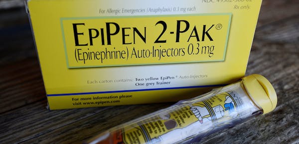 FILE - This Oct. 10, 2013, file photo, shows an EpiPen epinephrine auto-injector, a Mylan product, in Hendersonville, Texas. Mylan, now in the crossha