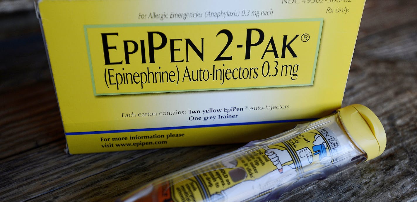 FILE - This Oct. 10, 2013, file photo, shows an EpiPen epinephrine auto-injector, a Mylan product, in Hendersonville, Texas. Mylan, now in the crosshairs over severe price hikes for its EpiPen, said Thursday, Aug. 25, 2016, it will expand programs that lower out-of-pocket costs by as much as half. (AP Photo/Mark Zaleski, File) ORG XMIT: MIN2016082511190709