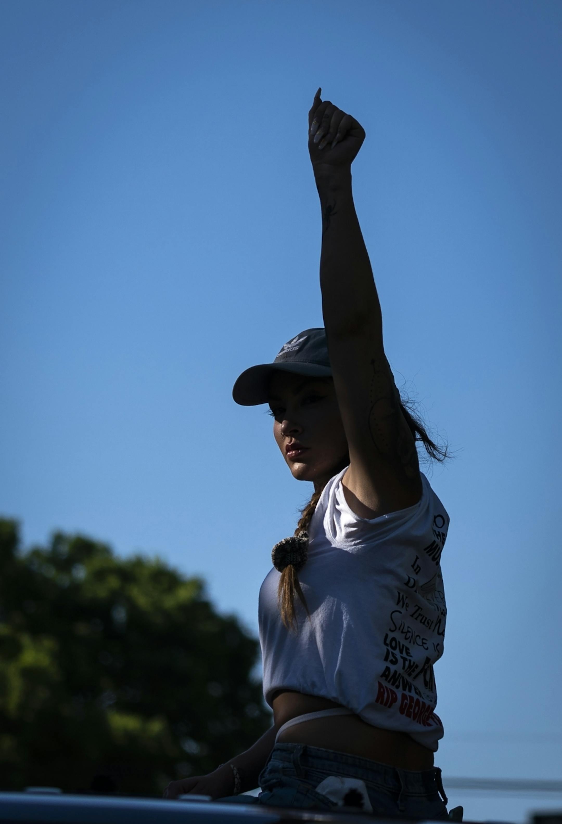 A protester raised her fist during a march that was headed back downtown after marching from U.S. Bank Stadium to Cup Foods.