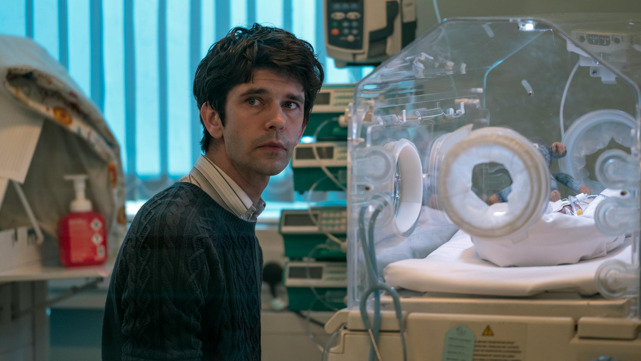 ADAM (Ben Whishaw) talking to Erika's baby. - This is Going to Hurt _ Season 1, Episode 2 - Photo Credit: Anika Molnar/Sister Pictures/BBC Studios/AMC