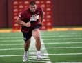 Offensive lineman Daniel Faalele ran during a three-cone drill during the Gophers annual pro day before NFL scouts on March 16.