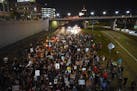 Protesters walked along an area of Interstate 94 in St. Paul after marching from the Capitol in response to the grand jury decision in Breonna Taylor'