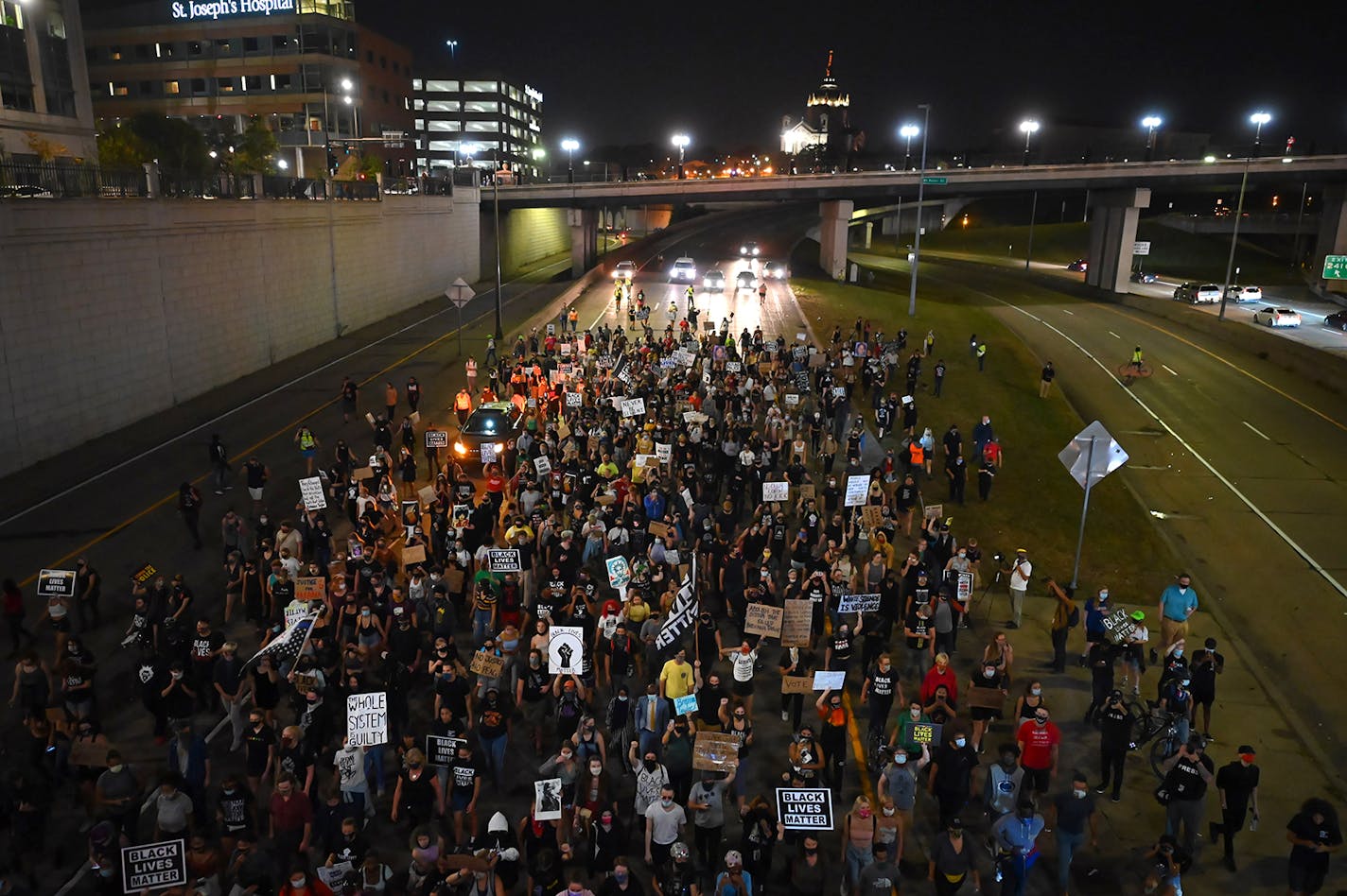 Protesters walked along an area of Interstate 94 in St. Paul after marching from the Capitol in response to the grand jury decision in Breonna Taylor's death.