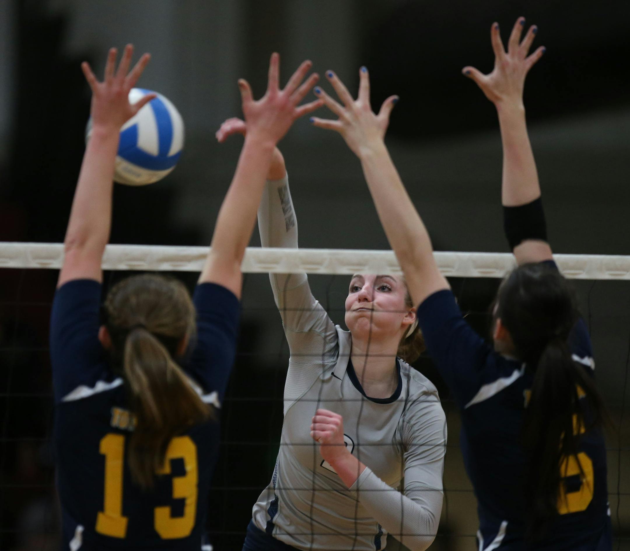 Champlin Park's Sydney Hilley spiked the ball passed the Totino-Grace defense. ] (KYNDELL HARKNESS/STAR TRIBUNE) kyndell.harkness@startribune.com Sectional finals Champlin Park vs Totino-Grace in Anoka., Saturday, November 1, 2014. Champlin Park won over Totino-Grace 3-0.