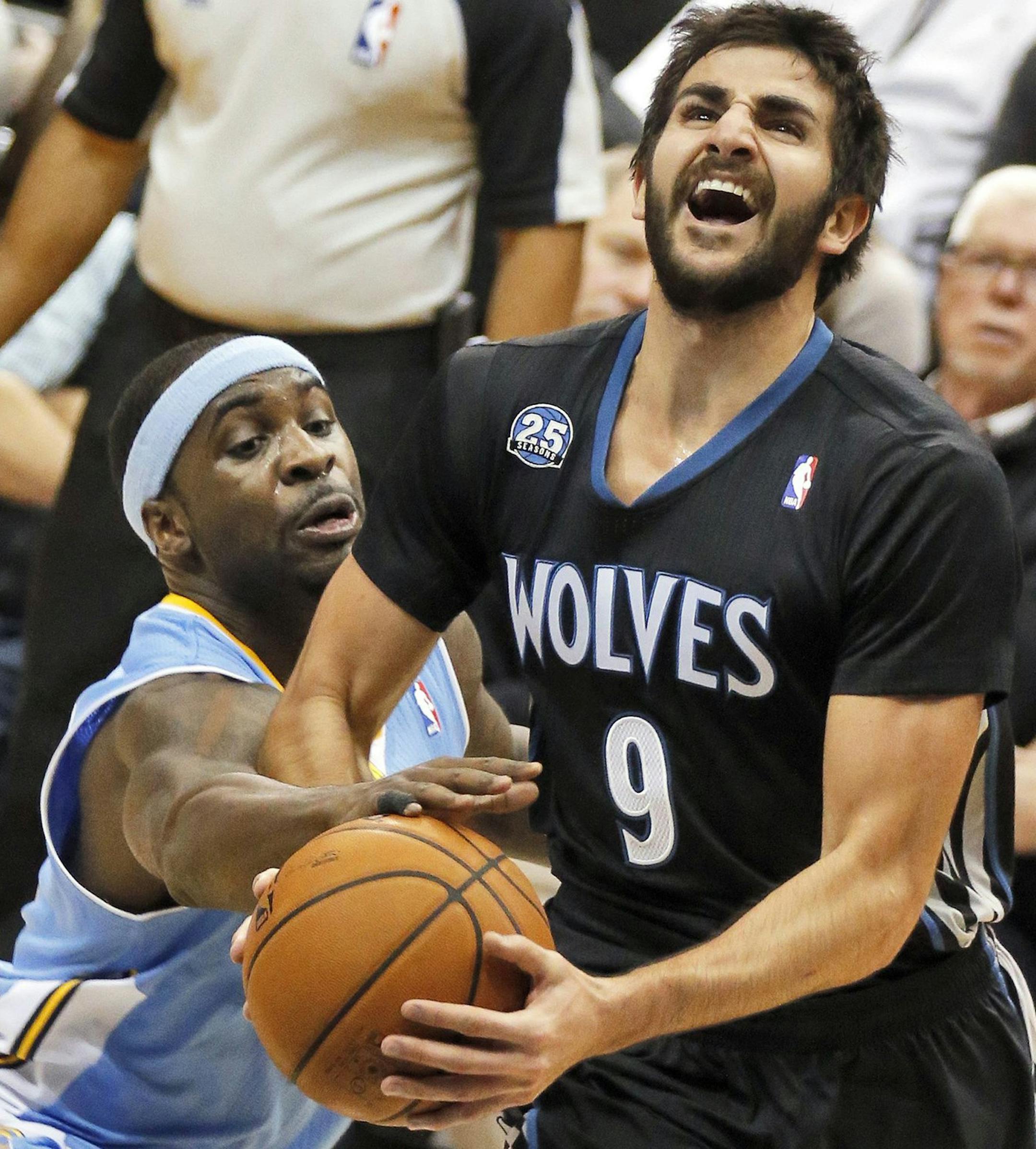 The Minnesota Timberwolves' Ricky Rubio (9) is fouled by the Denver Nuggets' Ty Lawson as he drives for a layup at the Target Center in Minneapolis on Wednesday, Nov. 27, 2013. (Marlin Levison/Minneapolis Star Tribune/MCT) ORG XMIT: 1146157