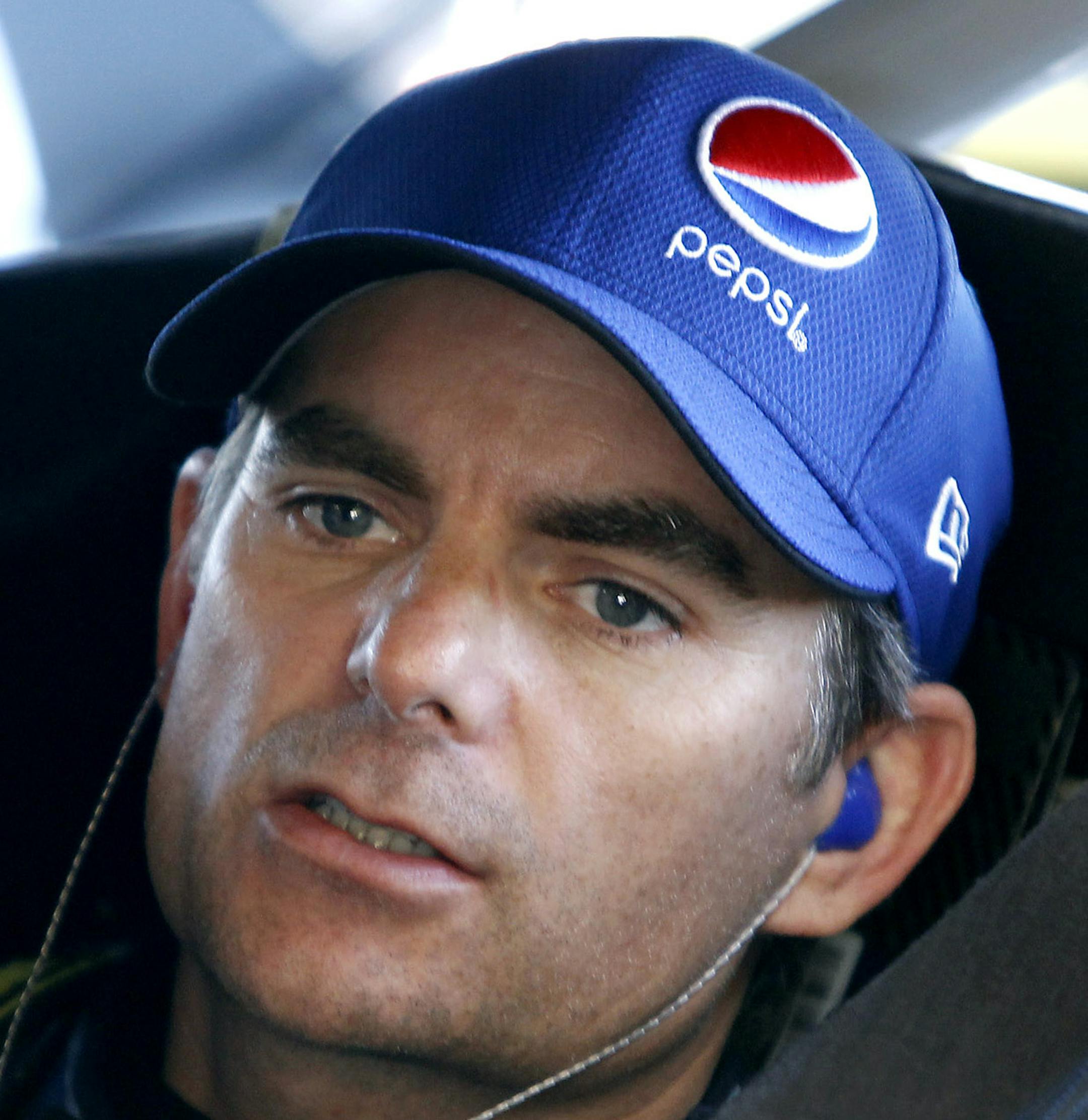 Series points leader Jeff Gordon sits in his car before a practice session for Sunday's NASCAR Sprint Cup Series auto race at Phoenix International Raceway, Saturday, Nov. 14, 2015 in Avondale, Ariz. (AP Photo/Ralph Freso)