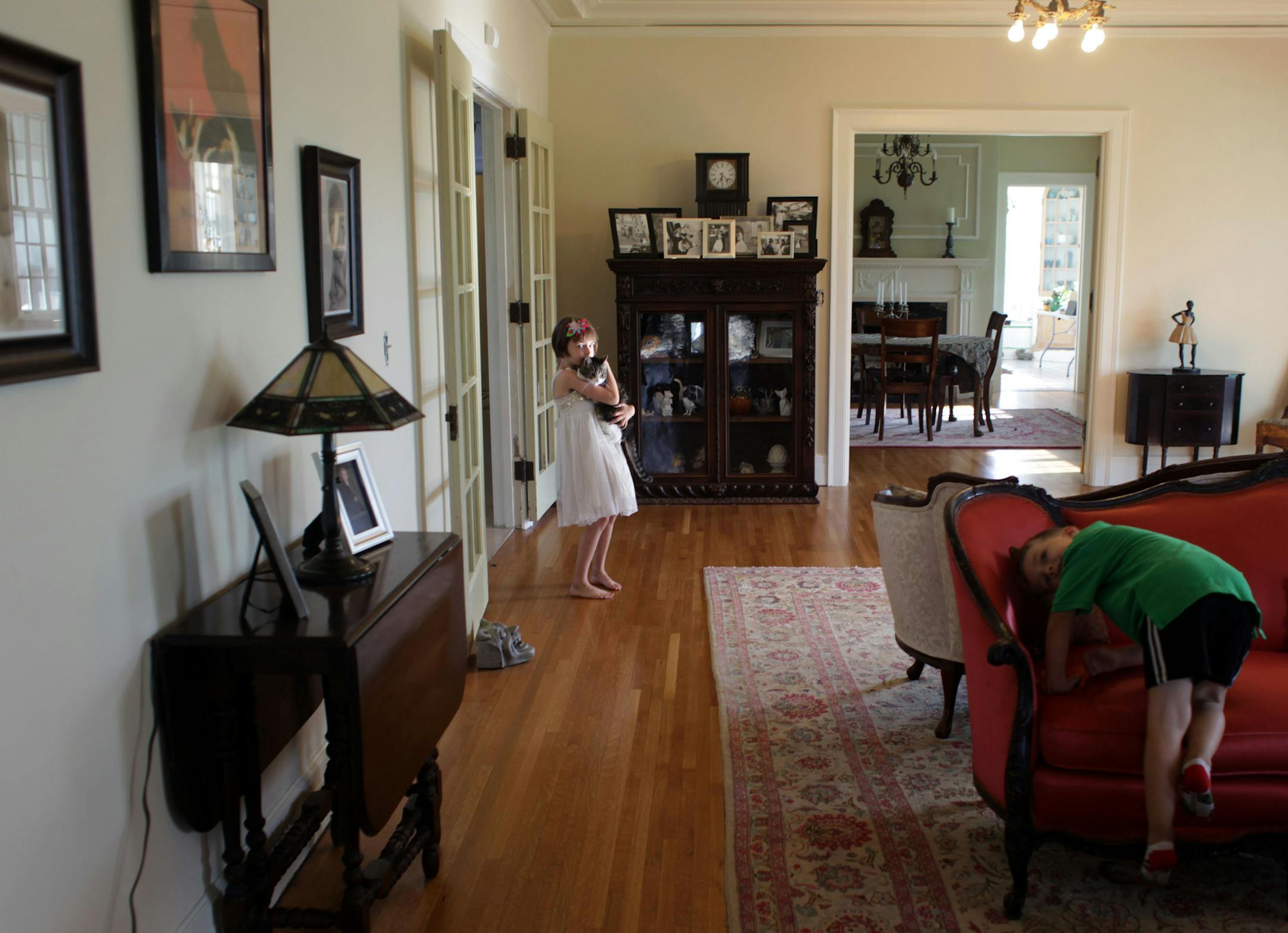 Maeryn Pier, 6, and Lucian Pier, 4, play in their living room on Thursday afternoon. ] Architect/homeowner Alissa Pier used original 1920s blueprints to restore this home in north Minneapolis, after a tornado tore off its roof. MONICA HERNDON monica.herndon@startribune.com Minneapolis, MN 07/24/14