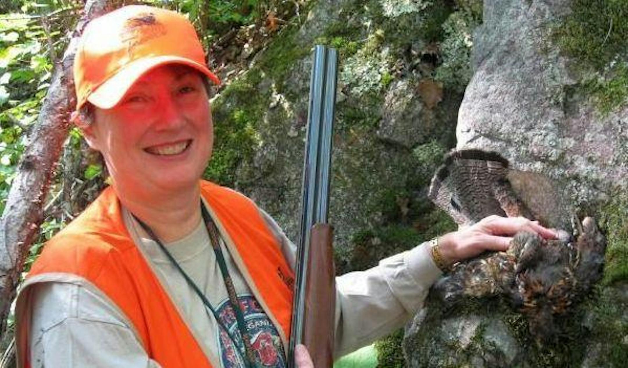 The author's mom with a ruffed grouse she bagged during Michigan's 2008 small game season.