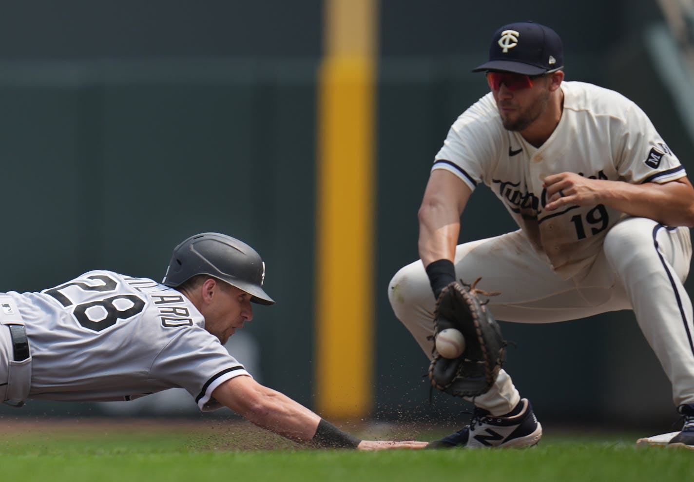 Minnesota Twins first baseman Alex Kirilloff (19) checks Chicago White Sox second baseman Zach Remillard (28) on first base in the fifth inning in Minneapolis, Minn., on Sunday, July 23, 2023. Twins take on the White Sox at Target Field.] RICHARD TSONG-TAATARII • richard.tsong-taatarii @startribune.com