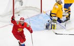 Russia's Marat Khusnutdinov reacts to the team's goal against Sweden during the third period of an IIHF World Junior Hockey Championship game Wednesda