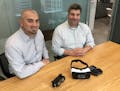 Doug Gigi, left, and Lance Wolfson, right, of Interior Architects' Charlotte office, displaying two virtual reality headsets. They're using virtual re