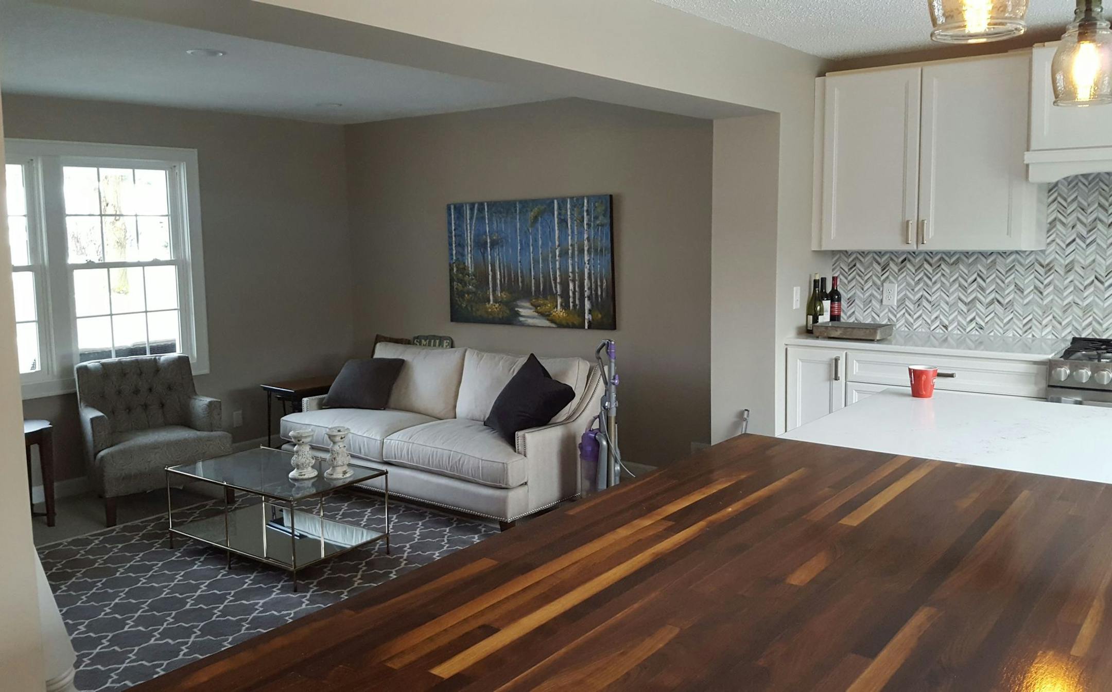 The kitchen opens to the living room, and the opening was widened.