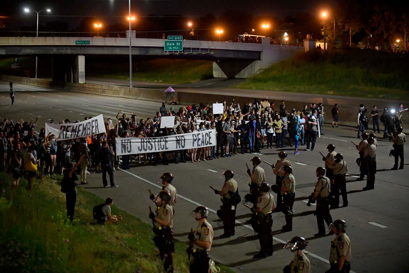 Officers met supporters of Philando Castile on Interstate 94 in St. Paul near Dale Street after leaving a vigil Friday night at the State Capitol.