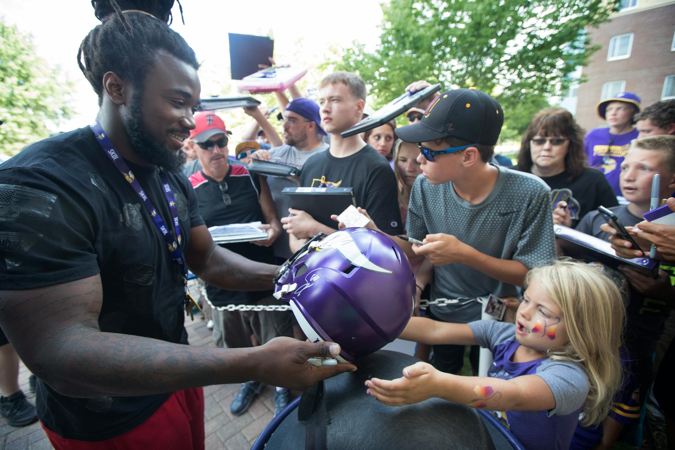 Vikings rookie running back Dalvin Cook autographed helmet for Tatum Smith 6, as rookies and select players arrived at Vikings training camp at Minnesota State University Mankato Sunday July 23, 2017 in Mankato, MN. ] JERRY HOLT � jerry.holt@startribune.com