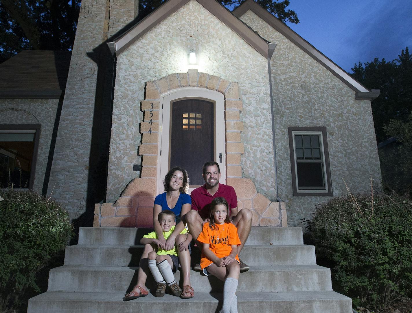 Rena Kraut, Mike Takalo, Dylan Takalo, 5, and Ella Takalo, 7, photographed outside of their Longfellow home in Minneapolis. These first-time buyers wanted to be in the Longfellow in Minneapolis put in 7 offers before they got one.