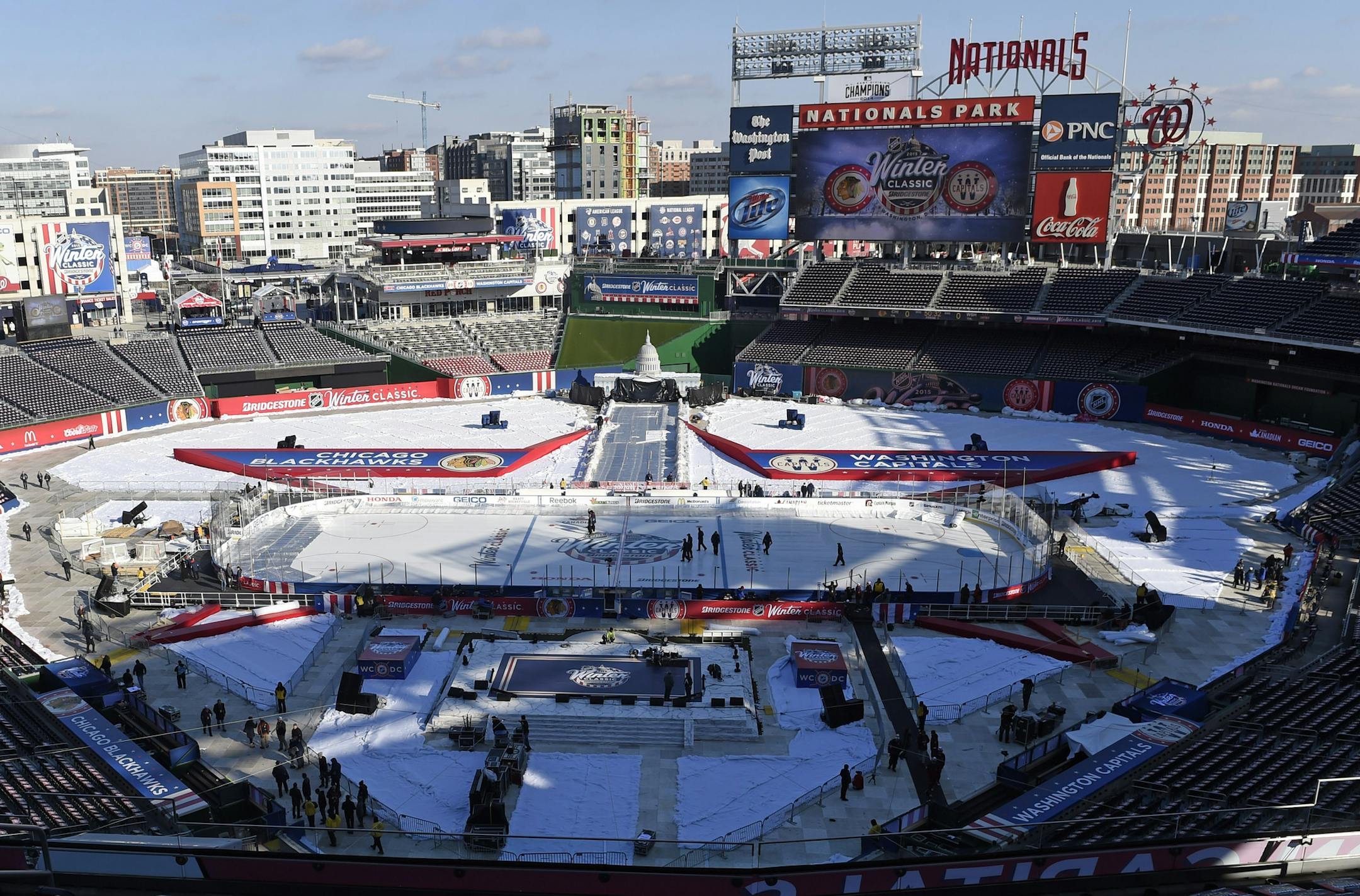 Final preparations are made at Nationals Park, Wednesday, Dec. 31, 2014, for the Winter Classic outdoor NHL hockey game to be held on New Year's Day. The Washington Capitals are scheduled to play the Chicago Blackhawks. (AP Photo/Susan Walsh)