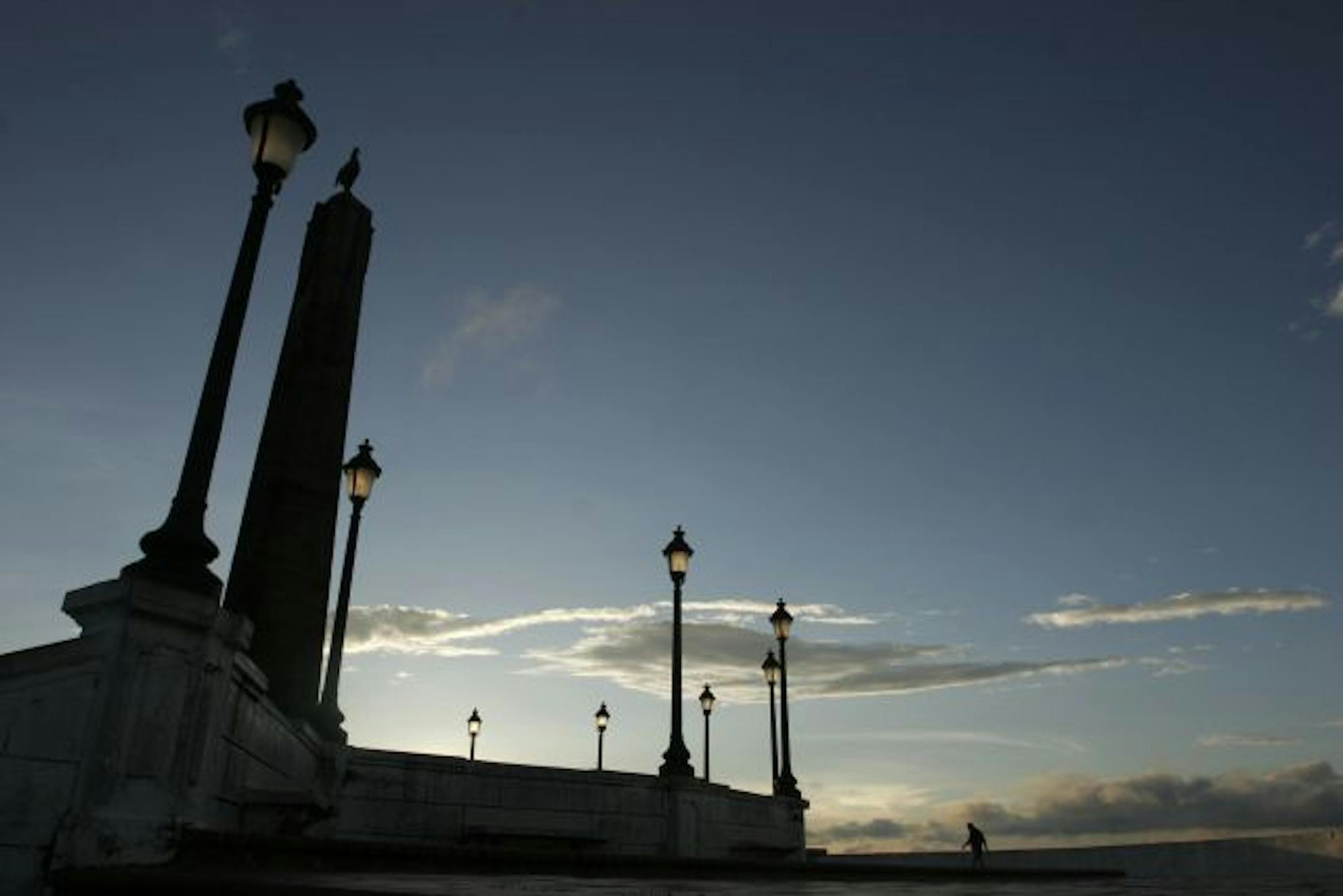 A man takes an early morning walk on Paseo de las Bovedas in Casco Viejo, For centuries, locals have watched the sunset from the Paseo de las Bovedas, a sea walk along an old Spanish military fort that served as a prison. Photo: Arnulfo Franco/Associated Press