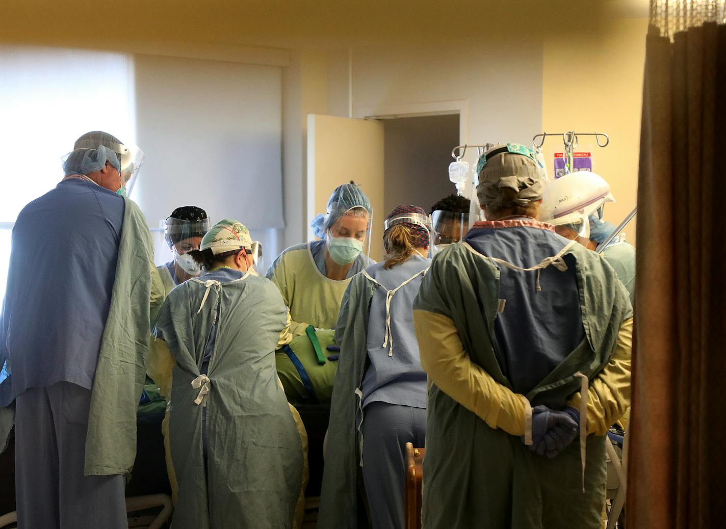 Healthcare workers prone a COVID-19 patient on the fifth floor ICU at Bethesda Hospital Thursday, May 7, 2020, in St. Paul, MN.] DAVID JOLES &#x2022; david.joles@startribune.com Every time a COVID-19 patient leaves Bethesda Hospital alive, a bell rings throughout the St. Paul facility. Its a moral-booster for doctors and nurses -- as they struggle with a vexing disease, limited protective supplies, and the threat of many, many more cases to come when the state eases off its social distancing str