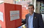 Rogelio Yerena in Bogota, Colombia, is helping collect medicine at his restaurant, Budare's, to send to Venezuela, on August 2, 2016. Private donation