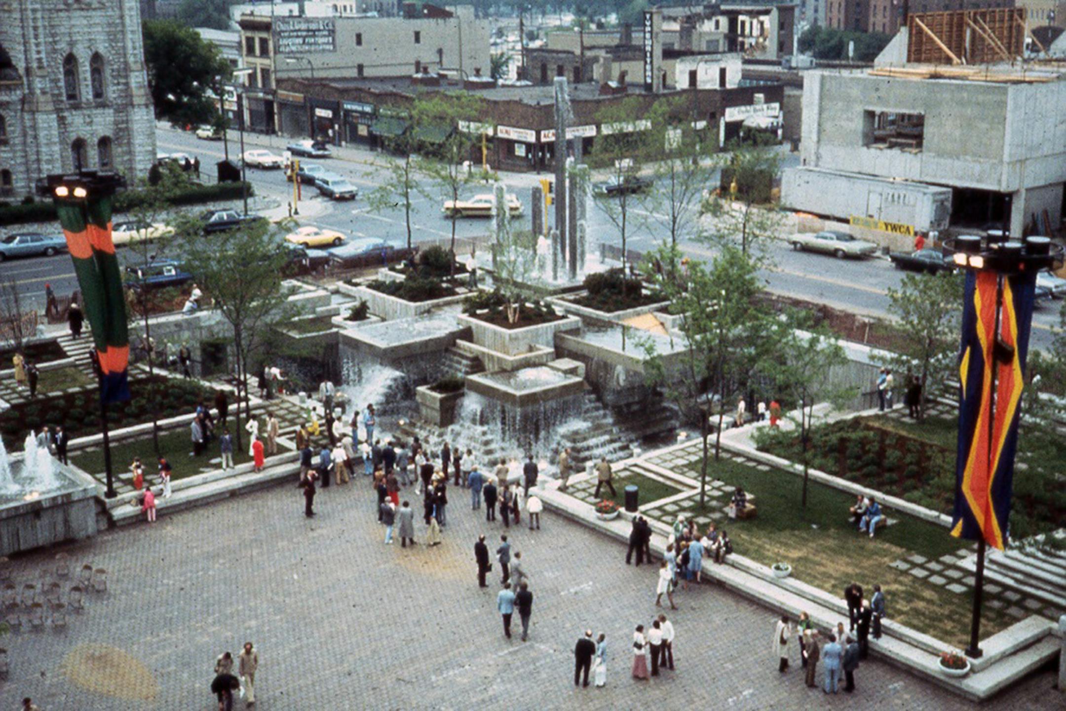 MN-2-9 PHOTO OF PEAVEY PLAZA SHORTLY AFTER OPENING. POOL DRAINED FOR EVENT. ALL MAJOR FEATURES VISIBLE. M. Friedberg & Associates, Photographer, Summer 1975