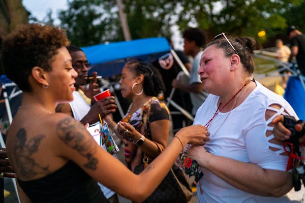 Alayna Albrecht-Payton, left, spoke with Daunte Wright’s mother, Katie Wright, during a July 4th celebration in his honor in 2021 in Brooklyn Center