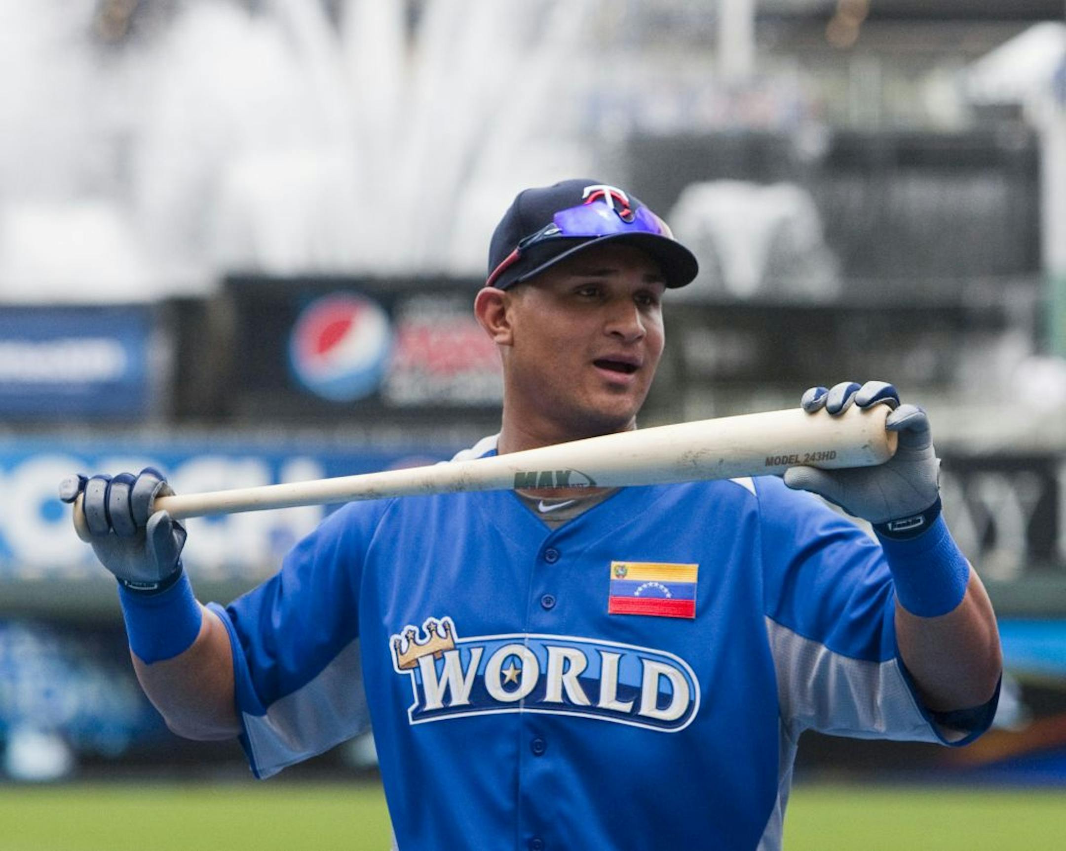 World Team out fielder Oswaldo Arcia (21) stretches with his bat in his hand during batting practice before the All-Star Futures baseball game at Kauffman Stadium in Kansas City, Missouri, Sunday, July 8, 2012.
