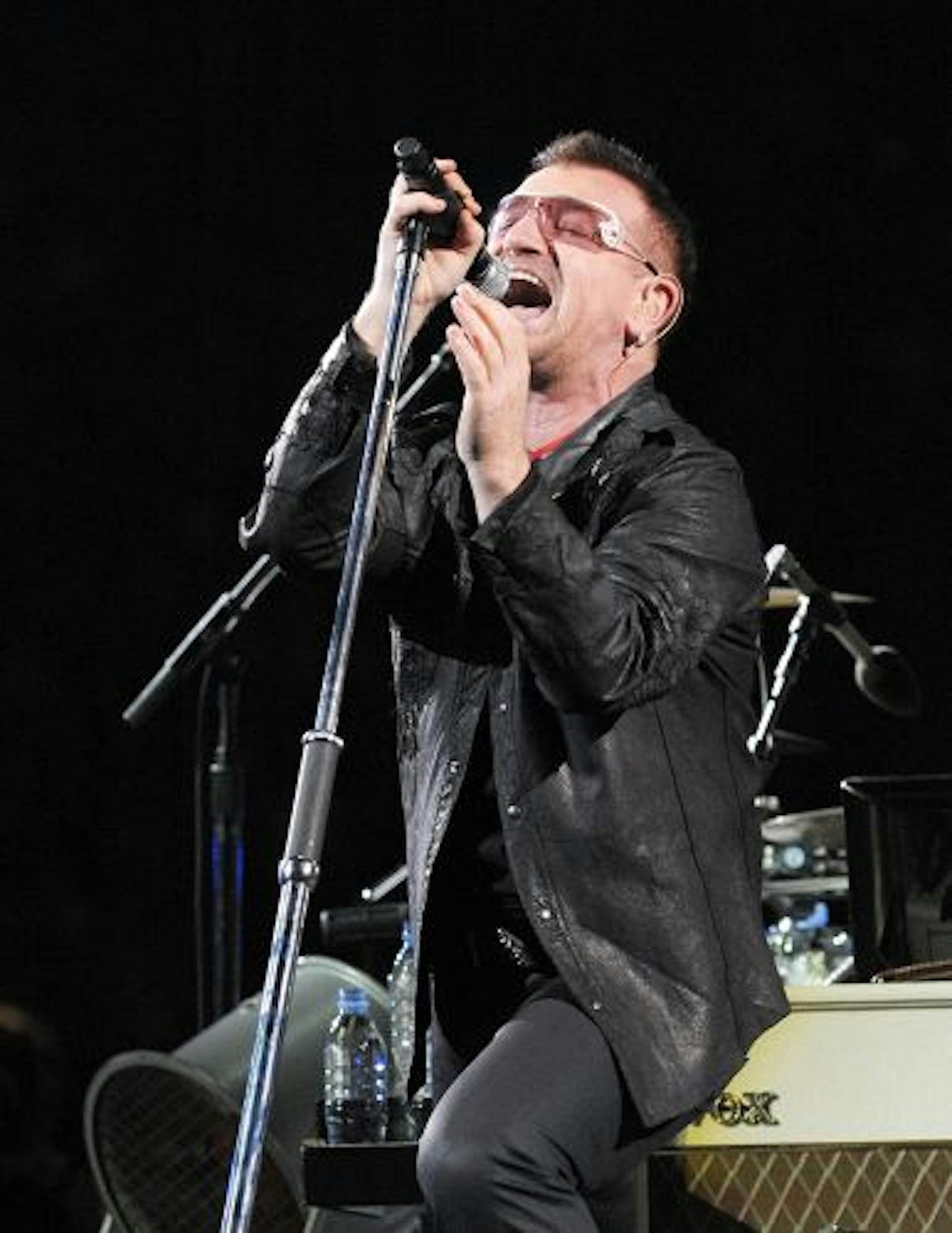 Singer Bono of U2 performs onstage during their "360 Degrees Tour" at the Rose Bowl on October 25 in Pasadena, California.