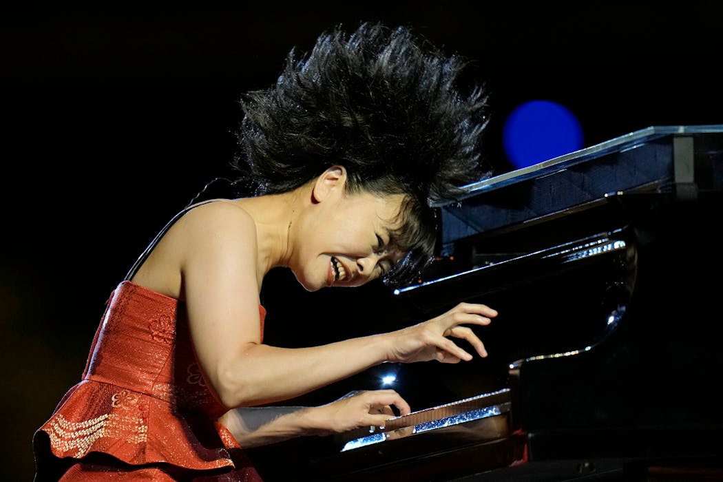 The pianist Hiromi performs at the Opening Ceremony.
