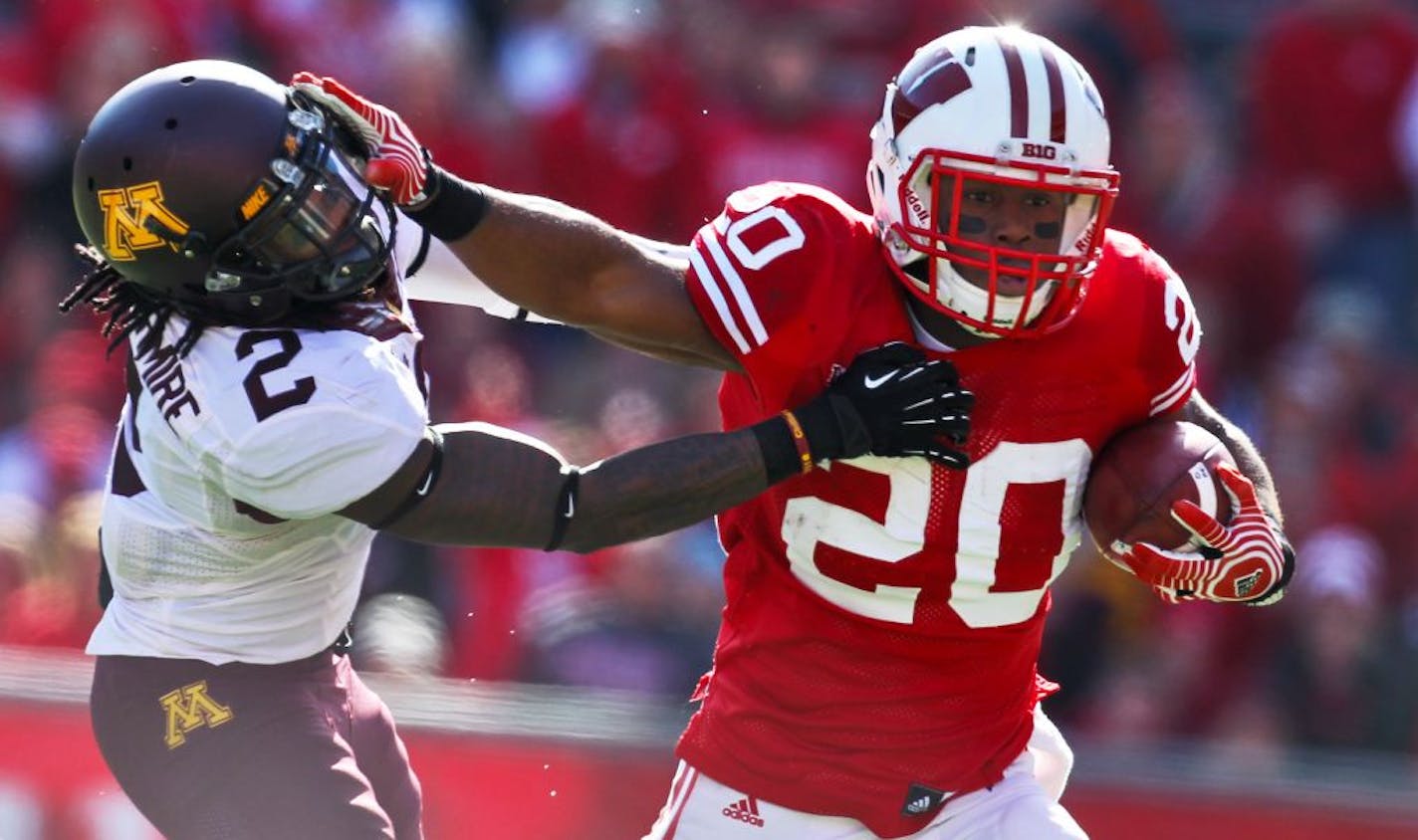 Minnesota Gophers vs. Wisconsin Badgers. Wisconsin won 38-13. Wisconsin running back James White picked up some of his 175-yards rushing in the game by stiff-arming Gophers defender Troy Stoudermire as he headed for a first-half touchdown. (MARLIN LEVISON/STARTRIBUNE(mlevison@startribune.com