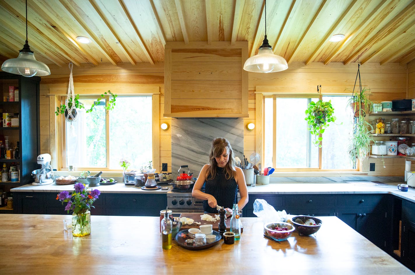 Chef Amy Thielen and artist Aaron Spangler recently expanded their Park Rapids, Minn., cabin to add a better kitchen for Thielen. ALEX KORMANN ¥ alex.kormann@startribune.com Amy Thielen is an award winning writer and former TV chef. Growing up in Minnesota, her husband, Aaron, built a cabin in Park Rapids, MN on lands his parents bought in the 1960s for hunting and camping. When they were young they would spend summers in the powerless cabin and have slowly built it up and expanded upon it. The