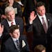 Rep. Tom Emmer, R - Minn. 6th, left, accompanied by his son, Billy, 15, is sworn in by Speaker of the House, John Boehner, R-Ohio, on the floor of The