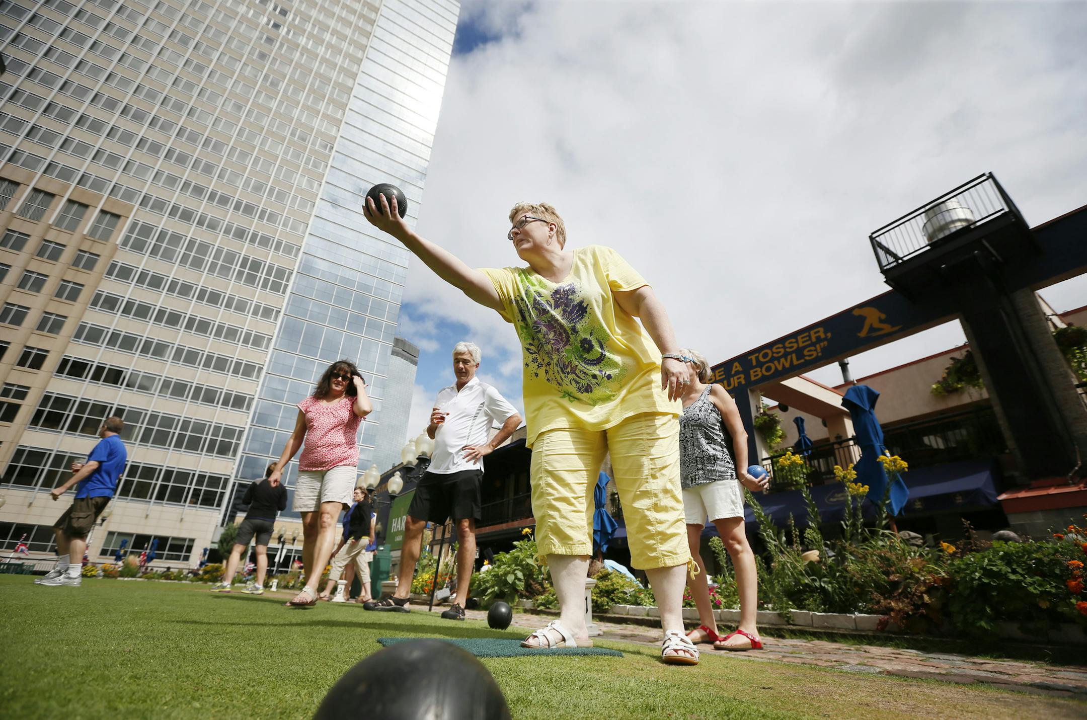 Katie Klemmer rolled a ball across the lawn with a group of friends who enjoyed the weather and lawn bowling at Brit's Pub Sunday September 01 ,2013 in Minneapolis , MN. ] JERRY HOLT ‚Ä¢ jerry.holt@startribune.com