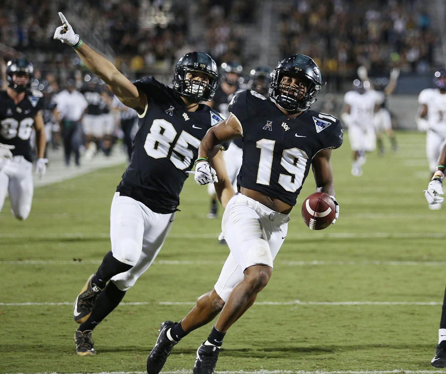 UCF returner Mike Hughes (19) returns a punt 63 yards for a touchdown during the third quarter against East Carolina in October.