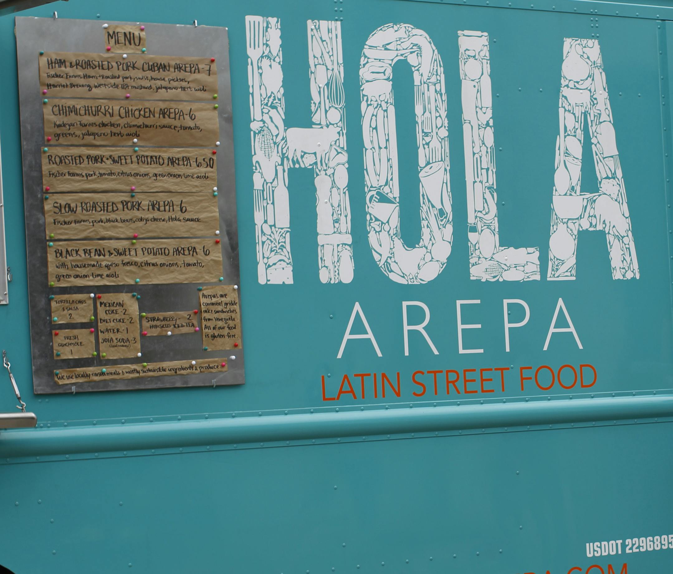 Bri Triviski runs an order out from the Hola Arepa food truck, owned by Birk Grudem and Christina Nguyen. ___ For the eighth year of the Taste Special Section called Taste 50, we talk about 50 movers and shakers in the foodie world. Portraits of faces and hands help tell the story of the folks. [ TOM WALLACE √¢‚Ç¨¬¢ twallace@startribune.com _ Assignments #20023383A_ May12, 28 2012_ SLUG: taste50_0524_ EXTRA INFORMATION: CQ'ed