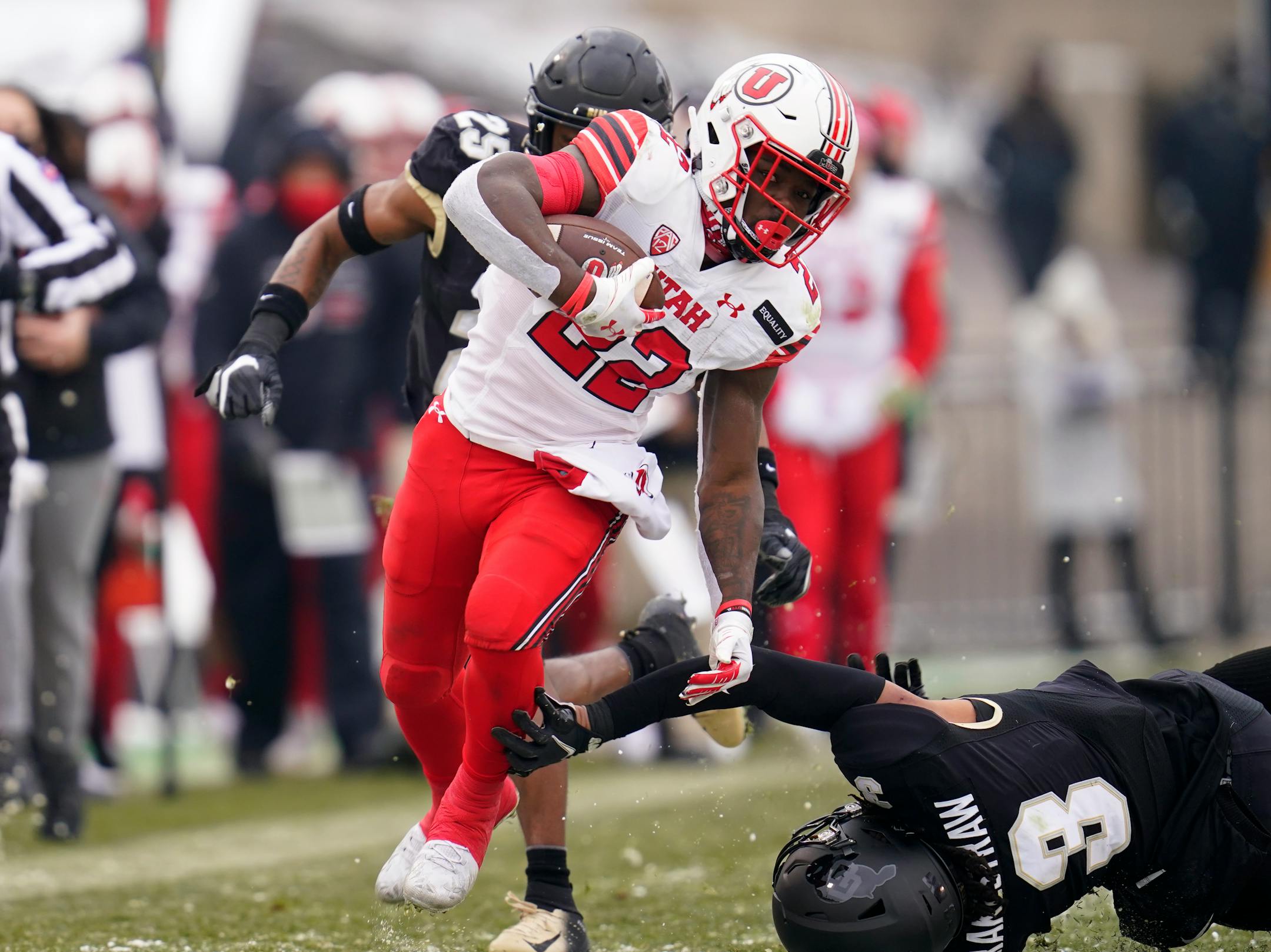 Utah running back Ty Jordan avoids Colorado safety Derrion Rakestraw for a long gain in the second half of an NCAA college football game Saturday, Dec. 12, 2020, in Boulder, Colo. Utah won 38-21. (AP Photo/David Zalubowski)