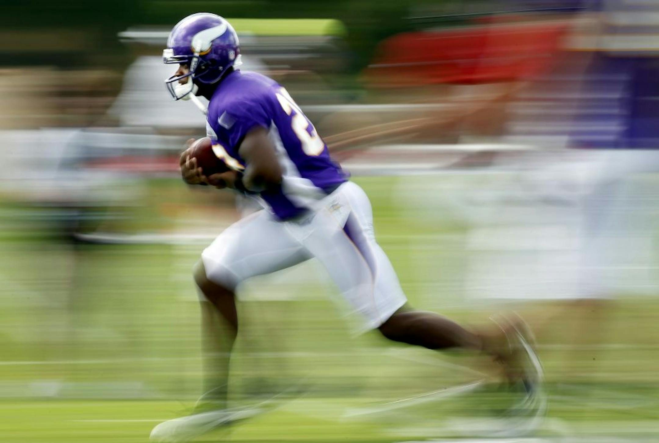 Minnesota Vikings running back Adrian Peterson (28) took a handoff during the afternoon practice on Monday. .