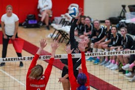 Lakeville South’s Emily Moes hammered a spike on Tuesday during a 3-1 victory over Lakeville North. The match pitted two teams from the state’s to