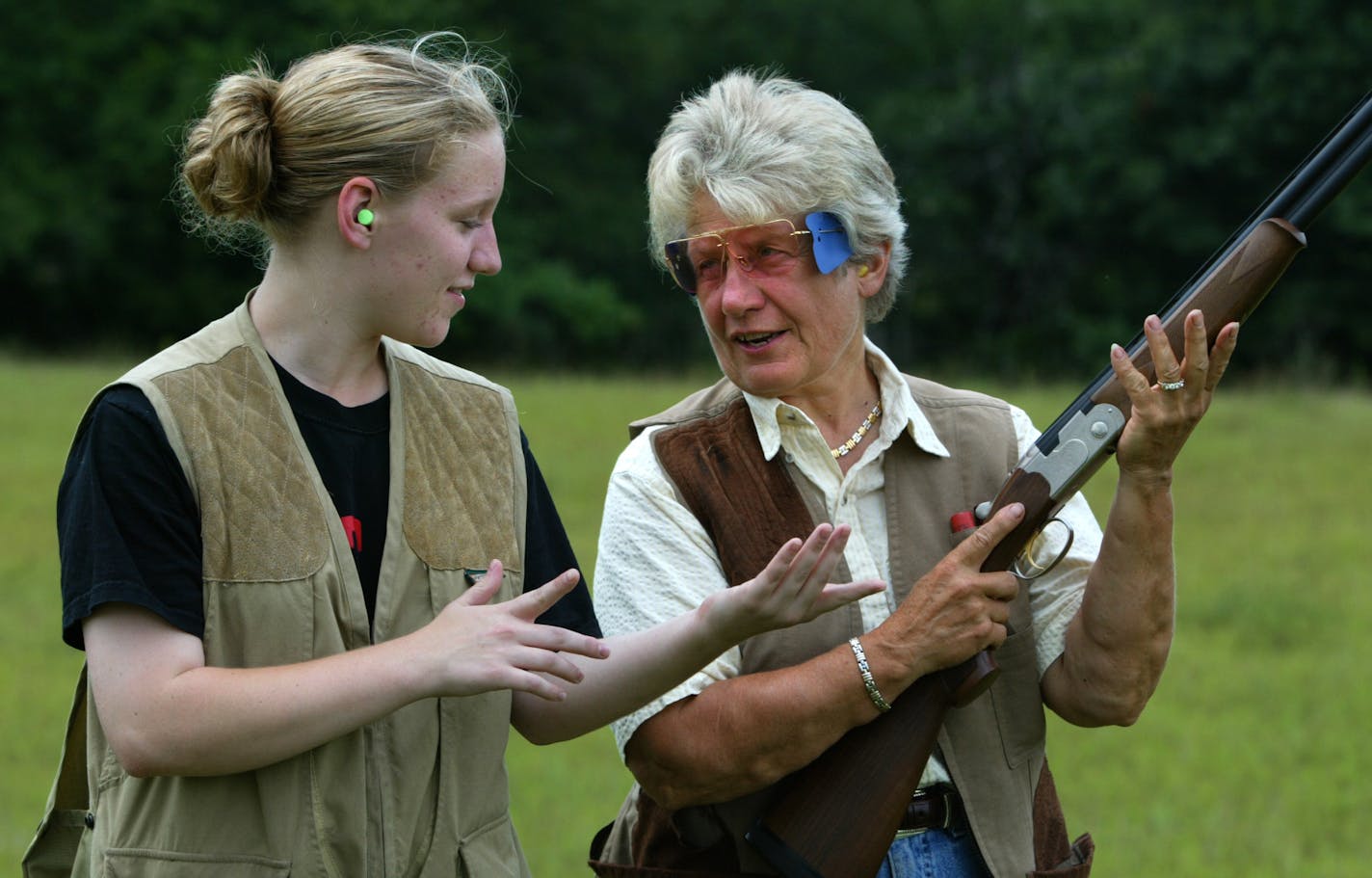 Anoka, MN., Wednesday, 8/6/2003. Chandra Miller, age-19, received trapshooting lessons from her grandmother, Loral I Delaney. Delaney is a world champion trapshooter. Loral I and Chuck Delaney are co-promoters of this weekends Game Fair, where they will offer daily shooting lessons for young people.