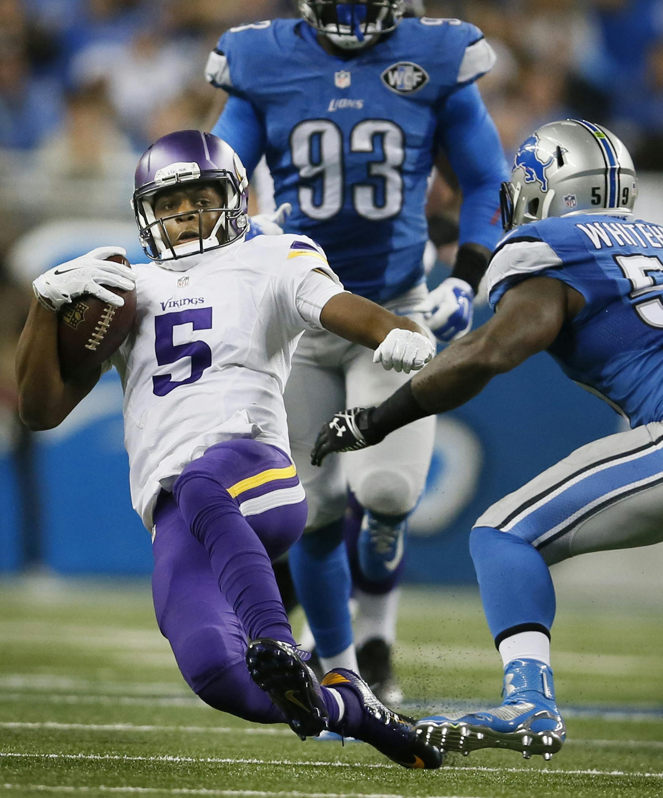 Minnesota Vikings quarterback Teddy Bridgewater (5) picked up a first down sliding past Detroit Lions middle linebacker Tahir Whitehead (59) in the third quarter at Ford Field Sunday December 14, 2014 in Detroit , MI. ] The Minnesota Vikings played the Detroit Lions at Ford Field . Jerry Holt Jerry.holt@startribune.com