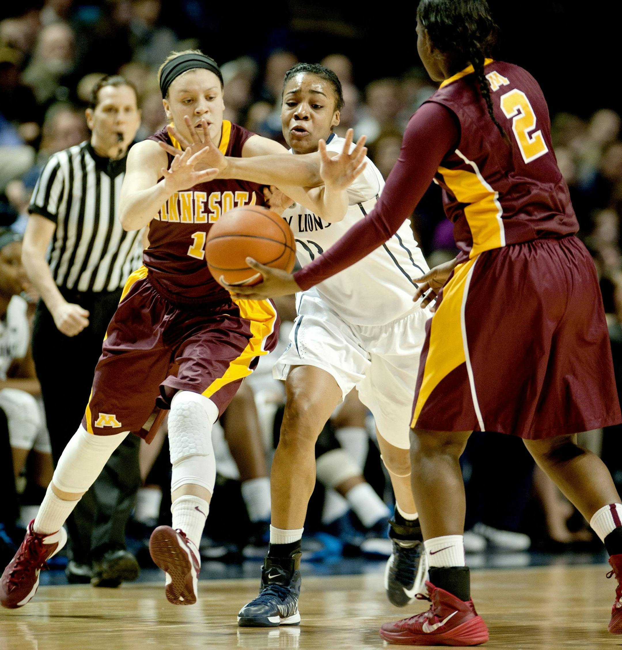 Penn State's Ariel Edwards tries to block Minnesota's Rachel Banham as she is tossed the ball from teammate Stabresa McDaniel during a women's college basketball game at the Bryce Jordan Center in State College, Pa., on Sunday, Jan. 26, 2014. The Penn State Lady Lions defeated the Minnesota Gophers, 83-53. (Abby Drey/Centre Daily Times/MCT)