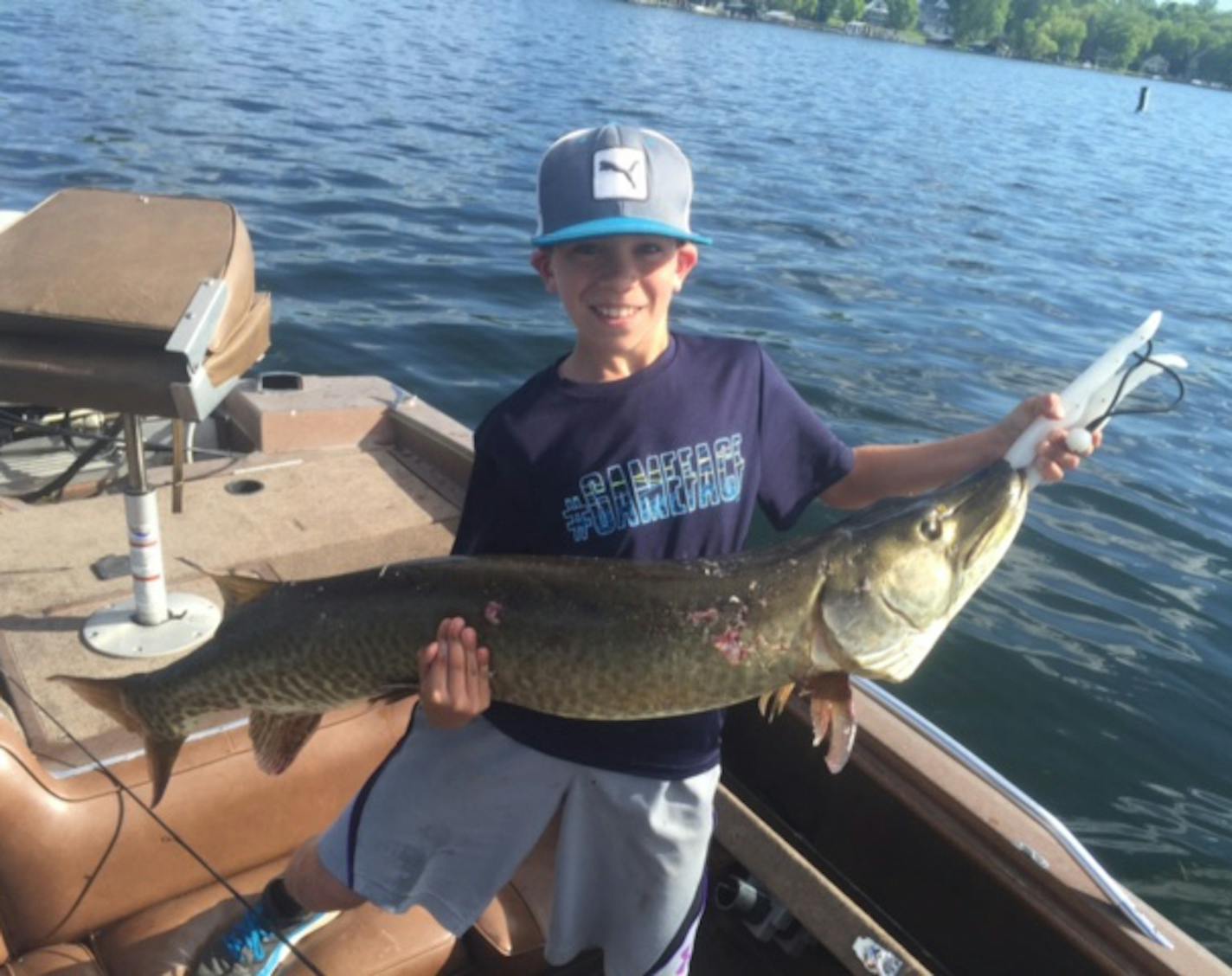 11-year old Jack Schaefer, of Orono, had only been out on Lake Minnetonka for 10 minutes when he caught this 47-inch muskie. Schaefer, fishing with his $1 lure, reeled it in all on his own.