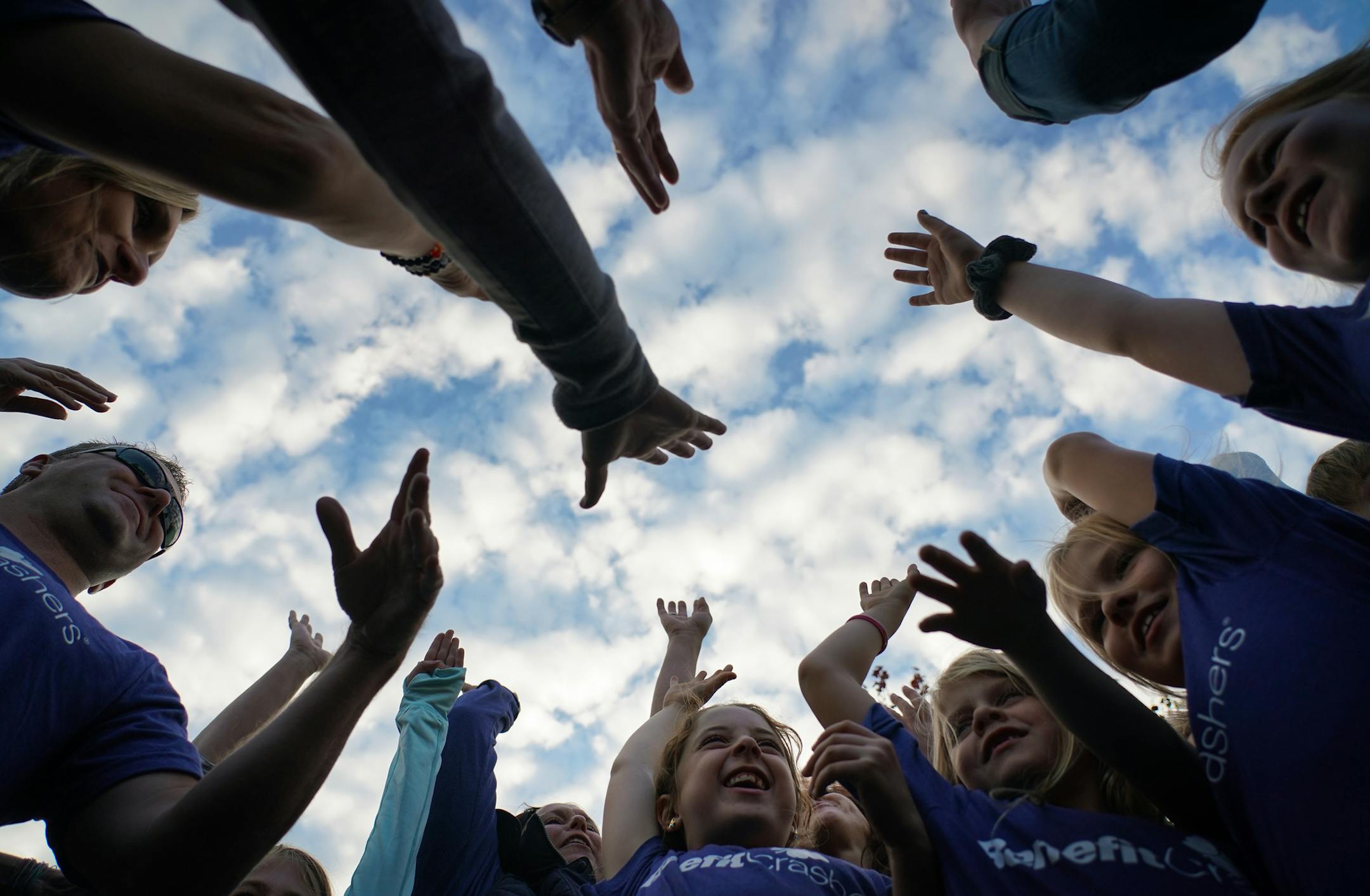Over 50 adults and kids with the Benefit Crashers made a surprise entrance at a benefit for Cheri Ventrucci and her husband Alex. In this photo, the group cheered after saying a prayer before entering the event. ] Shari L. Gross ¥ shari.gross@startribune.com Story about a group called the Benefit Crashers. These wild and crazy volunteers crash benefits to make sure those benefits are a success. They show up as a surprise to the folks running the benefit. This is a benefit for Cheri Ventrucc