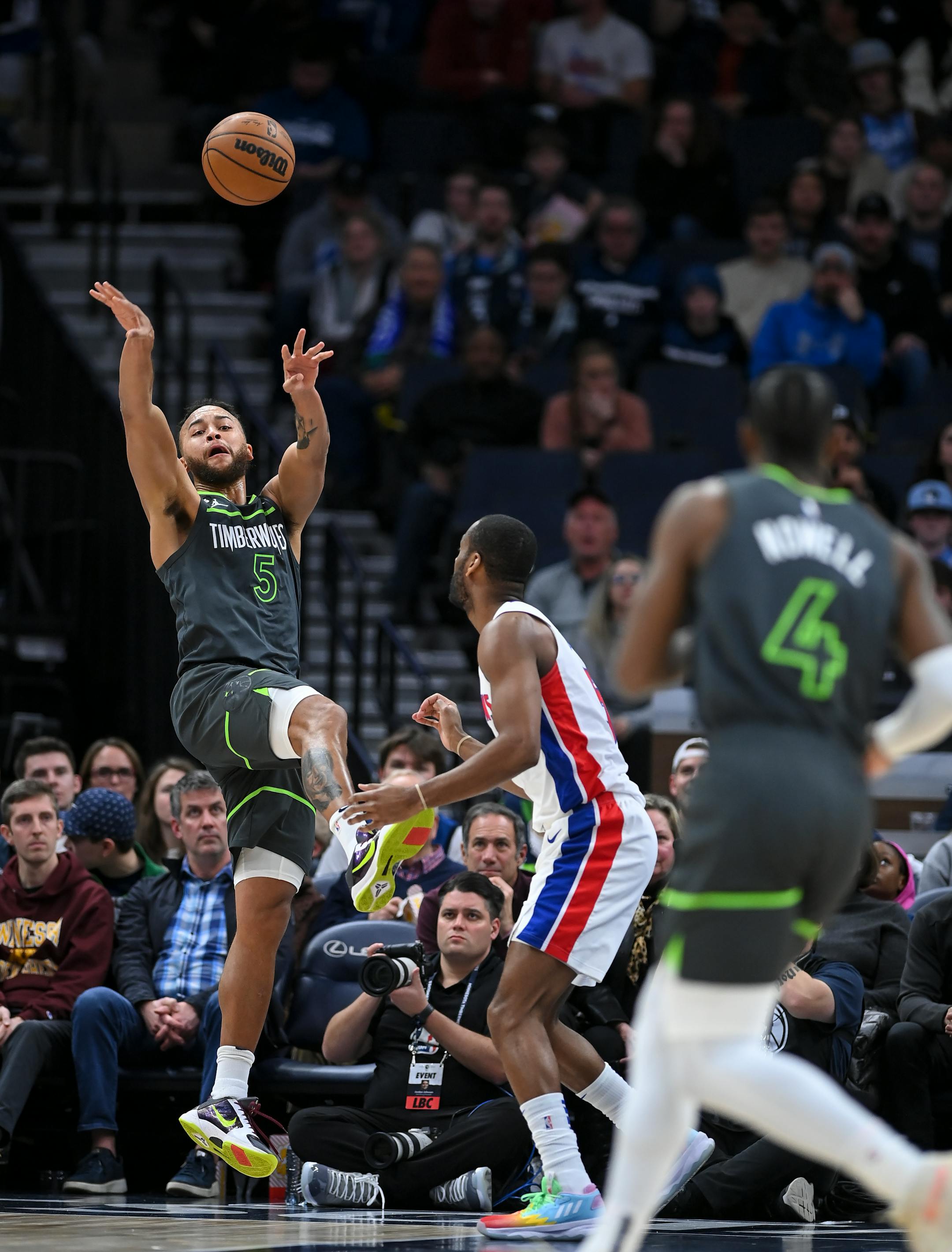 Minnesota Timberwolves forward Kyle Anderson (5) passes the ball to guard Jaylen Nowell (4) during the first half.